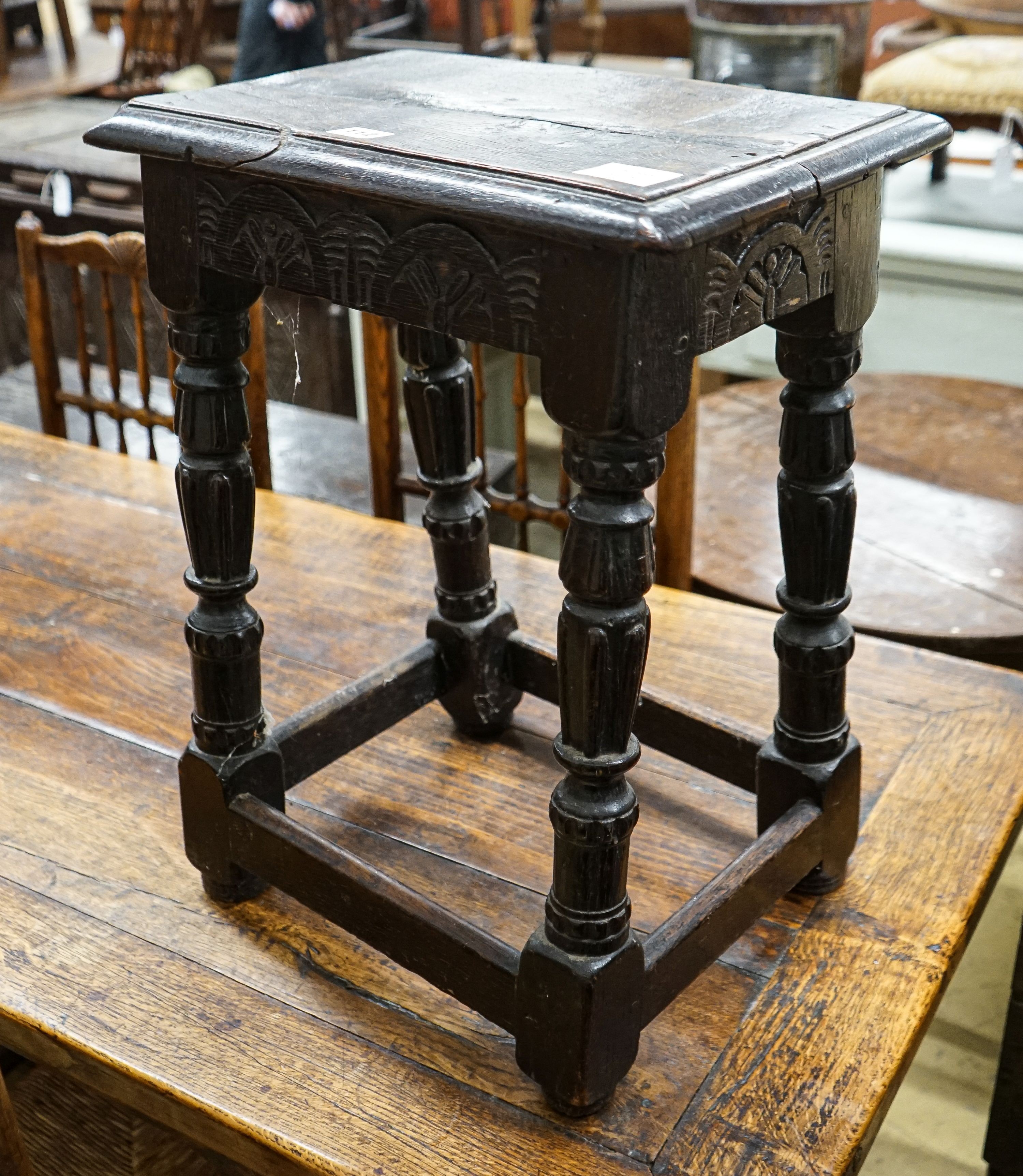 A late 18th century style stained oak joint stool, with turned and fluted legs, width 44cm, depth 28cm, height 56cm